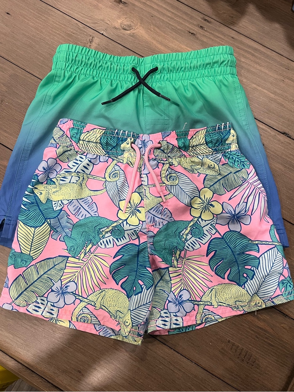 Swim shorts 2 pairs
tropical size Carters 6a
blue and teal Old Navy 6-7